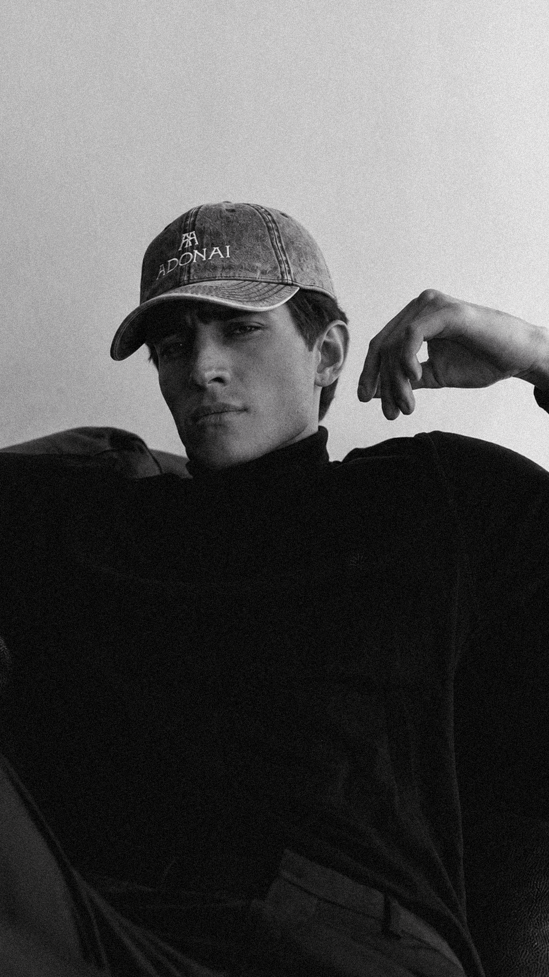 Adonai Reserve cap, worn with a black roll-neck